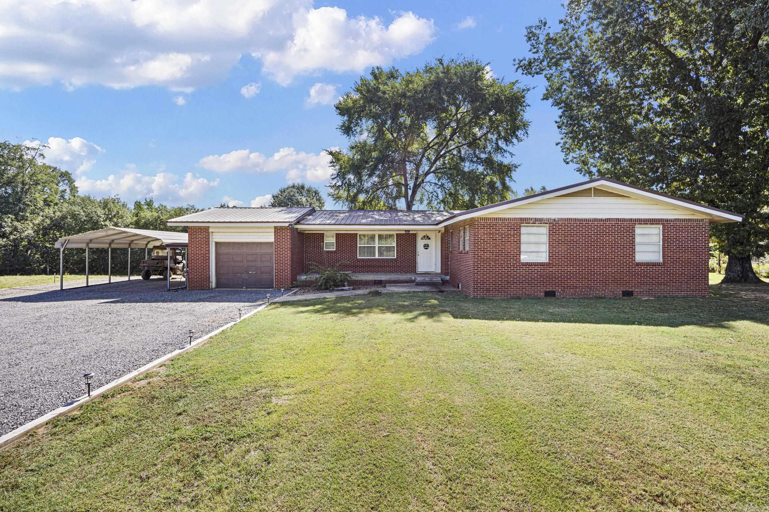 Discover peaceful country living with this beautifully maintained 3-bedroom, 1.5-bath home nestled on just over 5 acres of private, manicured land. Surrounded by mature trees and wide-open skies, this rural gem offers both comfort and serenity. Step inside to find an updated kitchen featuring a large island with bar seatingāperfect for entertaining or casual family mealsāalongside a cozy eat-in area and a separate formal dining space. The home also includes a dedicated laundry room, a partially finished basement, and plenty of storage throughout. Outside, enjoy the lush lawn, shade from fully grown trees, and plenty of parking with a 1-car garage plus an additional carport. This property offers space, privacy, and that rare feeling of being "away from it all" while still being close to modern conveniences. Whether you're looking for a forever home or a peaceful retreat, this one has it all. Schedule your showing today and come experience the best of rural Arkansas living!