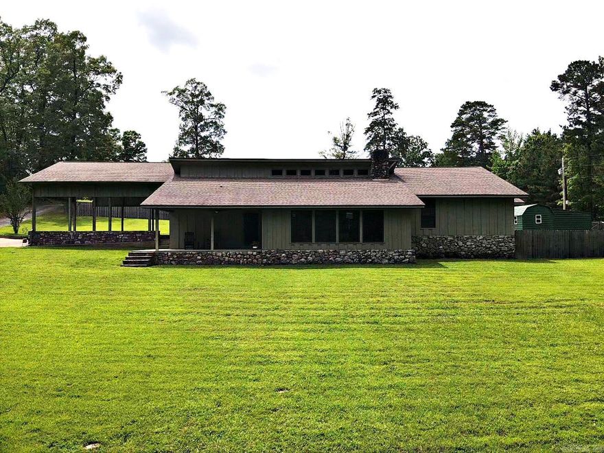 COUNTRY LIVING CLOSE TO TOWN! Traditional Cedar with Rock, 3 BR/2 BA, 2744 sq. ft. Spacious kitchen with breakfast bar, hardwood floors, tons of storage/counter space. Sunken great room with vaulted beamed ceiling, rock fireplace with word burning insert. Oversized windows allow lots of natural light. Custom tiled shower with clawfoot tub. Guest BR's have carpet and walk-in closets. Primary BR Suite with hardwood floors, over-sized walk-in closet with storage galore, shoe pantry and more. Custom tiled primary shower with matching corner jetted tub. Bonus room with stained concrete floor could be man-cave, office, playroom, or 4th BR. Fully fenced backyard complete with shop, chicken coop, and lean-to for mowers, boat, or ATV's. Outside city limits- BUT, minutes from town, schools, and shopping! Call Today!