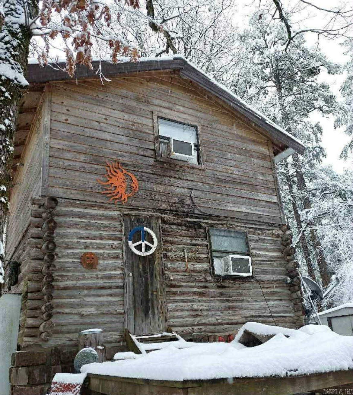 10 acres surrounded by NATIONAL FOREST!! 1bd/1ba log cabin! 2 beautiful creeks run along the property line!