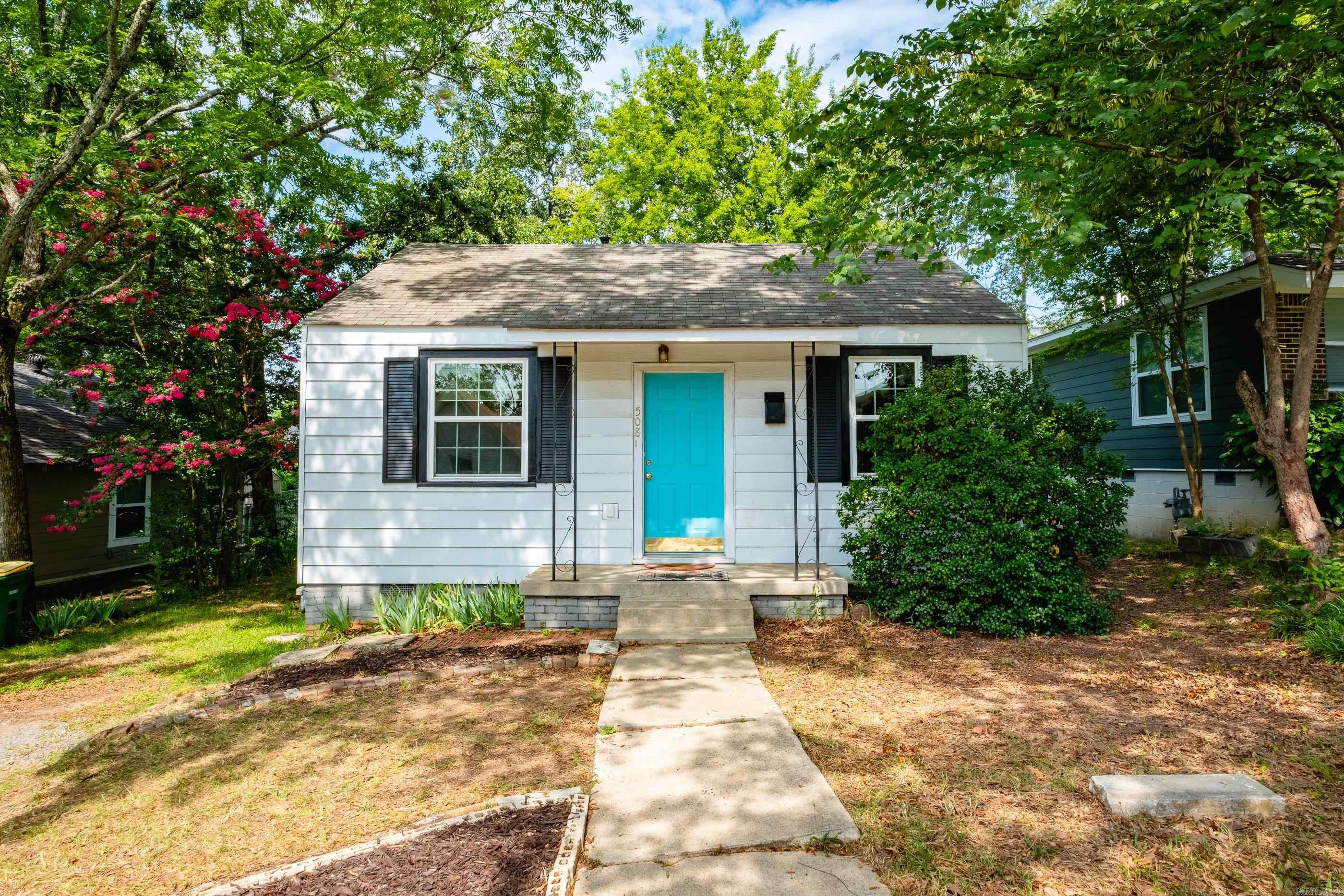 Charming 2BR/1BA Home – Ideal for First-Time Buyers or Investors! Only four blocks from UAMS! Featuring two spacious bedrooms and one full bathroom. The large laundry room includes a washer and dryer, and the paved parking pad in front adds convenience. Enjoy the expansive backyard, perfect for relaxing, entertaining, or future landscaping ideas. Don't miss this move-in-ready gem in a prime location! New HVAC 10/2024, new paint and flooring 7/2025, new windows 2/2020, new tankless water heater 2021, extra insulation in attic.