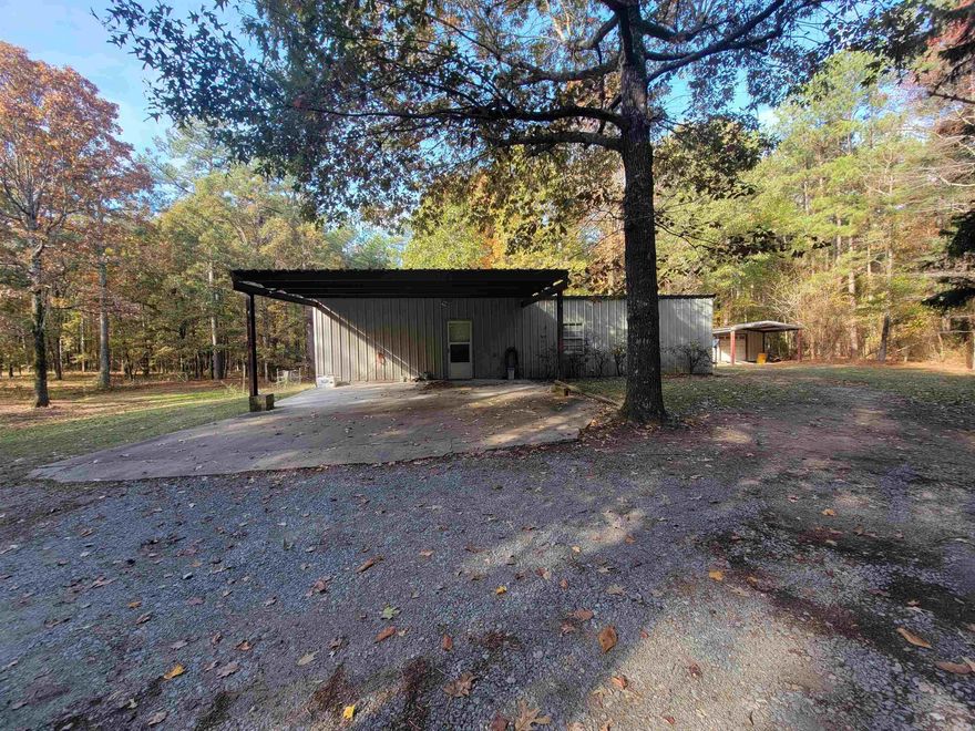 Located on a private drive this well maintained metal home has lots of privacy!! Storm Cellar! 18X33 Shop with electric! Several storage buildings from 6X8 to 8X10! Plenty of room for everything! Located outside the city limits with room to expand!! Don't miss out!