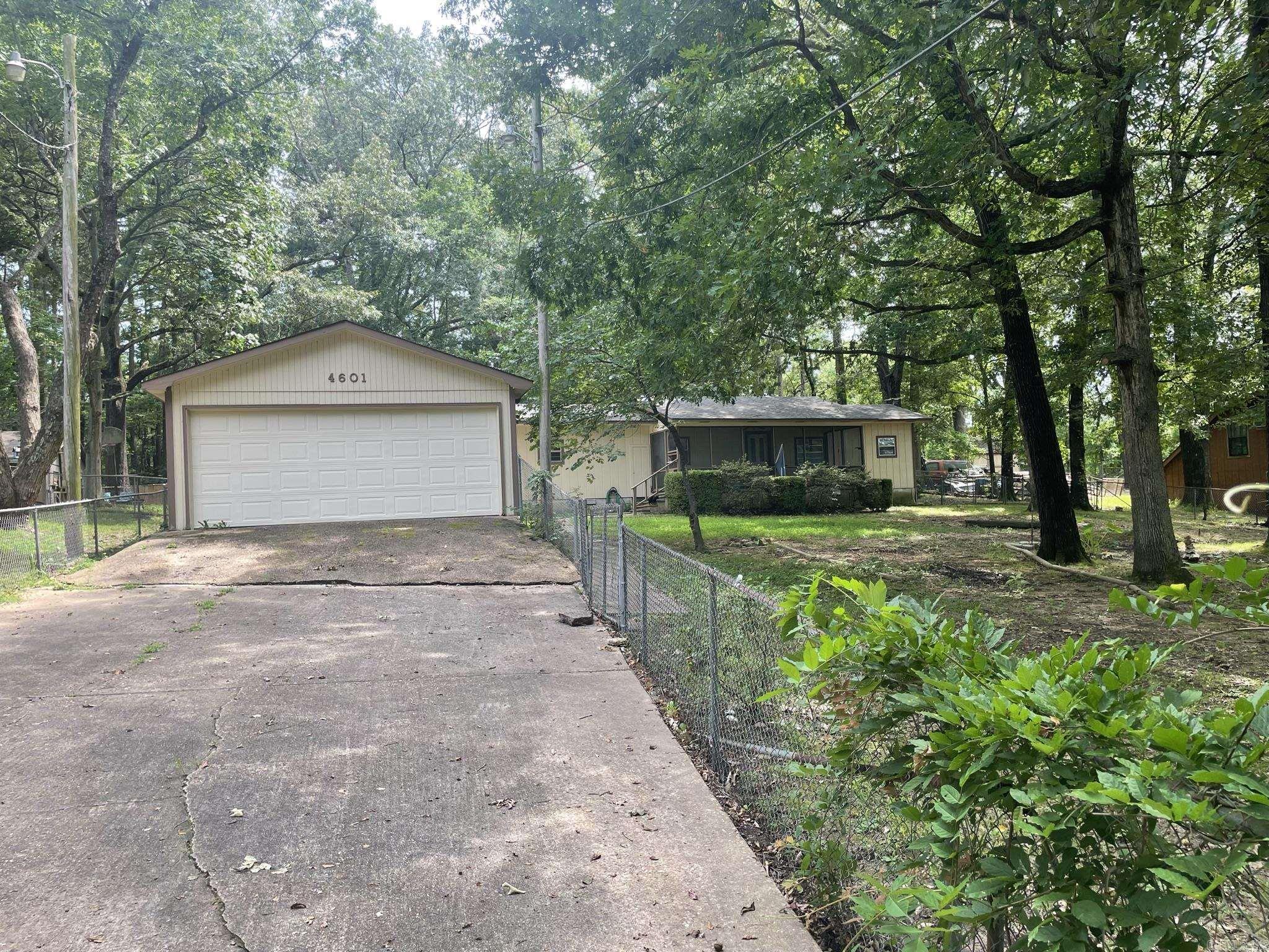 This property has lots of possibilities. This 3 bedroom and 1.5 bath mobile home that has additions that have been added on to the property. This includes a enclosed screen-in porch (24.2' x 7.9'). This property is a project person's dream with and a huge detached garage (23.1' x 46.1) and a second garage in the back of property that would work as a workplace. (20' x 30'). This property sits on a half acre of land. This property is a must see. A/C was replaced in the last 5 years, Hot Water Heater updated in 2016, Furnace in 2010. Property sold as is. *Please see agent remarks