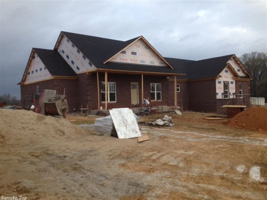 Beautiful craftsman style, split bedroom plan, hand-scraped wood floors, granite tops throughout, stainless appliances, separate office, walk-in closets galore, LowE windows, side entry garage, fantastic covered front and rear porches. A must see to appreciate. (See agent remarks.)