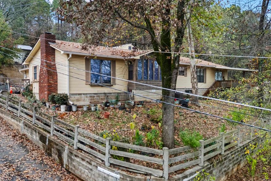 Check out this unique property just waiting for a new owner.  There are multiple opportunities with the property.  There is a 2 bedroom/2 bath home at the front of the property along with a 2 story shop.  Near the back you will find 2 other properties that would make  great rental properties with a little TLC.  Please contact listing agent for more info.