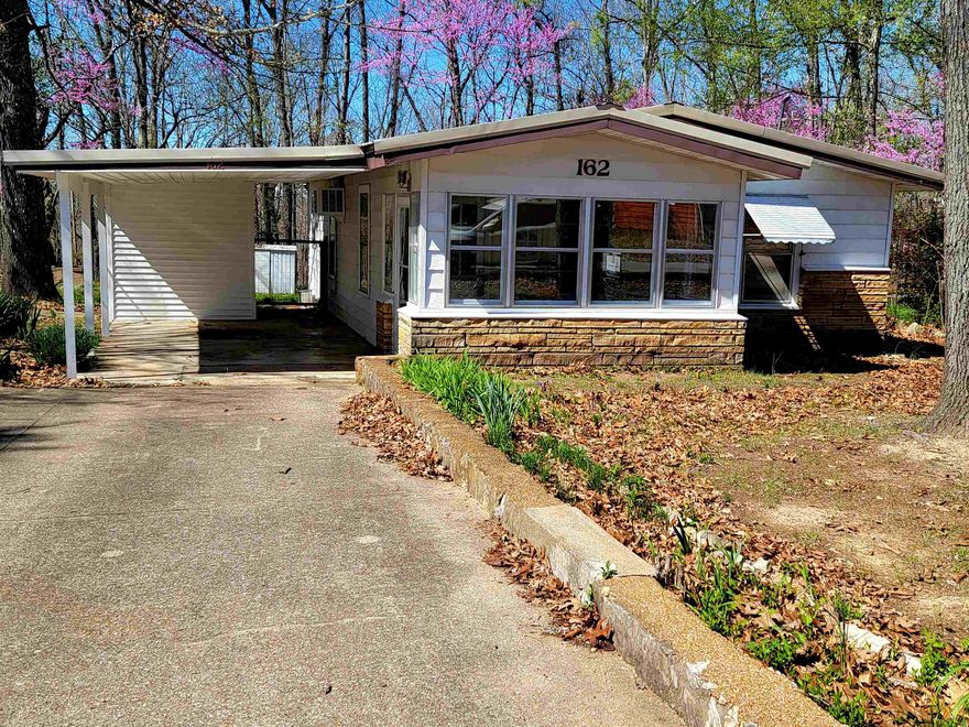 You have to see this beautiful Cottage. 2 Bedroom, 1 bath and updated. The screened porch is the perfect place to enjoy morning coffee or your evening beverage. The open concept kitchen/living area makes it feel so spacious. New: microwave, washer, dryer, range hood, ac/heater wall unit, refrigerator, hot water heater, new laminate floors in both bedrooms, and hallway, new Hunter fans and a new kitchen faucet.