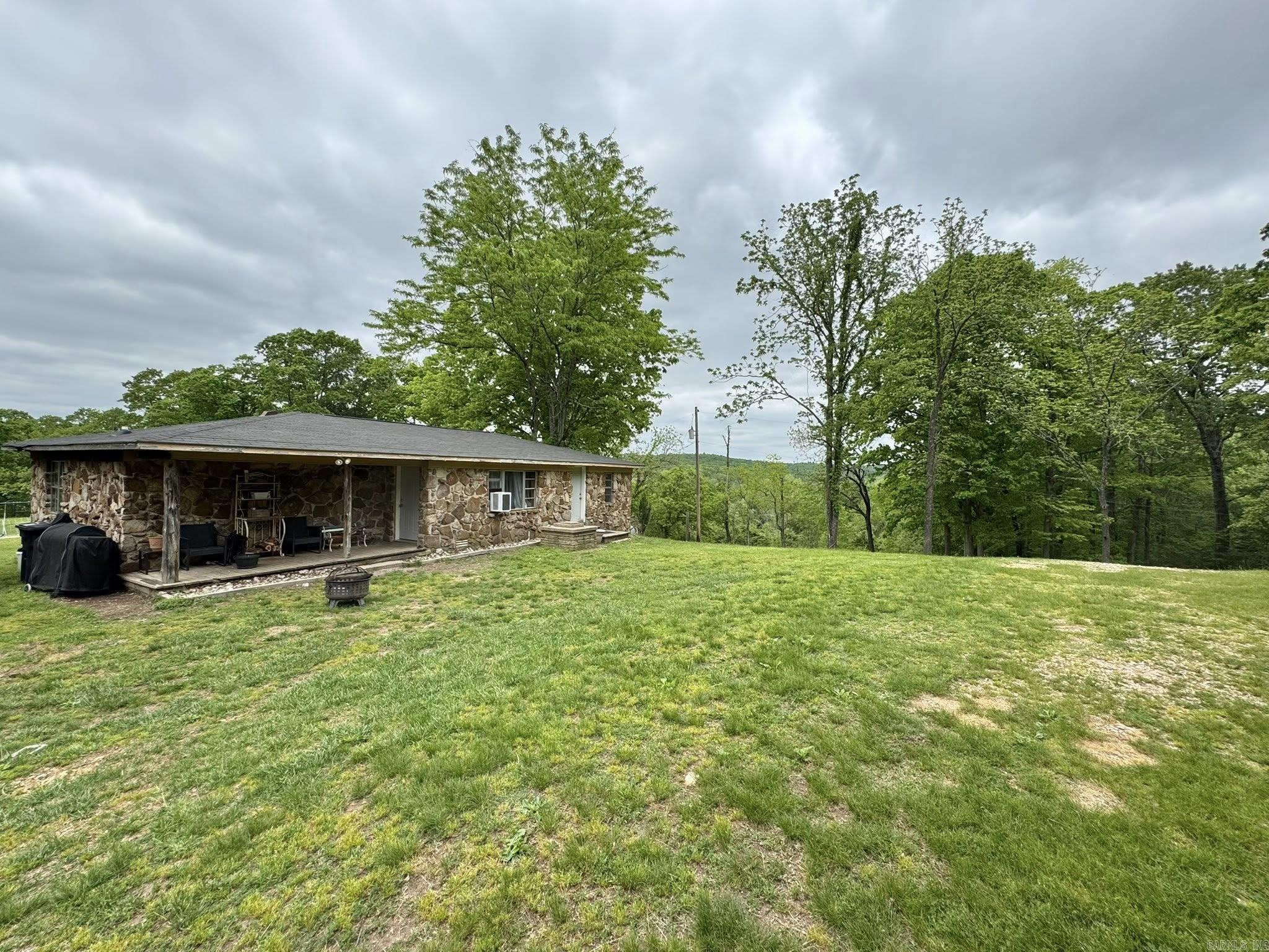 130 acres m/l, house, shop, hunting, pastureland, views, cave, Roasting Ear Creek! Welcome to your Ozark escape! Situated on 130 secluded acres near Mountain View, this property offers a 1,145 sq ft open-concept home with 2 bedrooms and 1 bath ā designed for simple, comfortable living. A 50x40 shop and two additional outbuildings provide excellent storage and workspace. Enjoy approximately 1/4 mile of year-round Roasting Ear Creek, a large cave, hunting opportunities, pastureland, and multiple building sites with breathtaking views. The property borders the National Forest near Fifty-Six, offering endless outdoor recreation. Tucked away from the highway yet just 10 miles from downtown Mountain View and minutes to Blanchard Springs Caverns and the White River. Private, peaceful, and full of potential ā a true piece of Arkansas heaven!