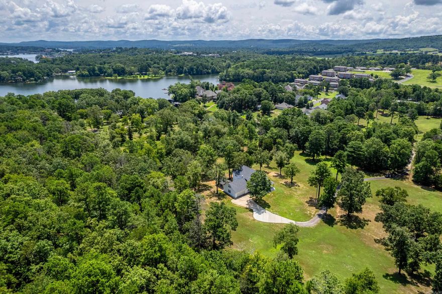 NESTLED IN A PRIVATE AREA - 10 MINUTES FROM THE CITY - is a 2.5 ACRE LOVELY SETTING FOR THIS OUTSTANDING HOME!  This Lakeside School District property is designed for a large family and includes 6 Large Bedrooms and 4 Bathrooms + an Office + a Bonus/Game Room.  The house has been immaculately maintained and is surrounded by wraparound porches, an abundance of light, windows + scenery!  The Open Family Room/Dining/Kitchen areas offer many built-ins and porcelain tile flooring. The Master BR and Laundry Room are on the main level and the Laundry includes another full bathroom.  Exterior has NEW low maintenance siding, a NEW roof, an oversized 2-Car Garage + Covered Shed for lawn equipment; a 5 Ton Trane Unit for the Lower Level is newer/the 4 Ton Unit has a new air handler.  Additional acreage is available.