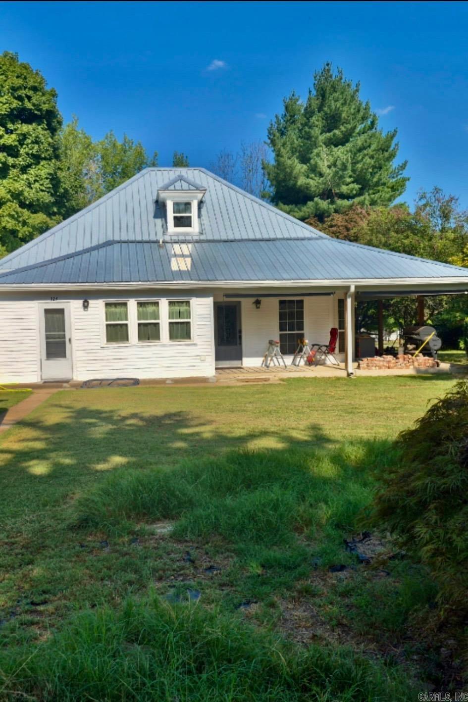 Charming 1905 home in Harrison Arkansas featuring 3 bedrooms, 2.5 bathrooms and approximately 1975 sq ft of living space on a .45 acre lot. This property blends modern updates with original historic character offering a shady yard, covered porch and plenty of outdoor space to enjoy.
