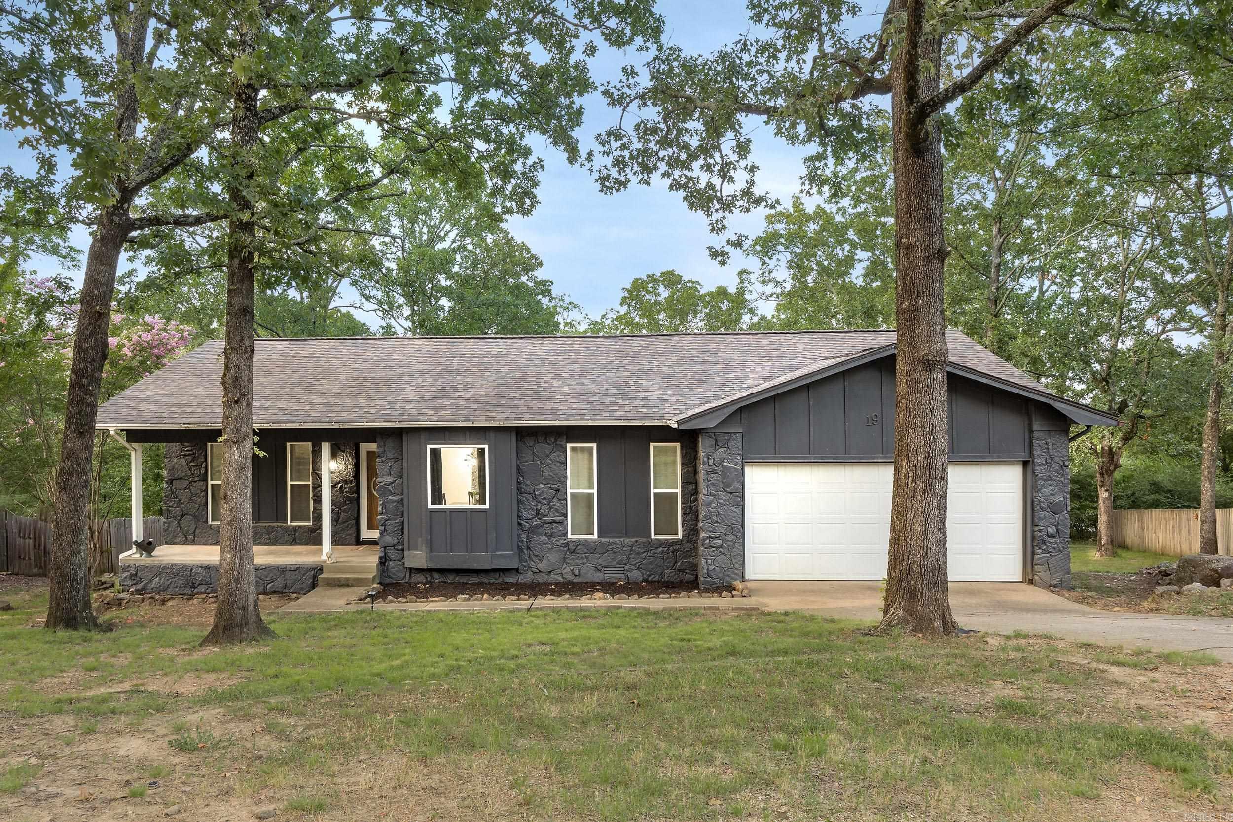 Welcome to 19 Millstone Cove — a beautifully remodeled 3-bedroom, 2-bath home nestled in one of Maumelle’s most desirable and quiet cul-de-sacs. This thoughtfully updated home offers a split floor plan with an open-concept living and dining area that flows effortlessly to a brand-new wood deck overlooking a spacious backyard — perfect for relaxing or entertaining. Inside, enjoy luxury vinyl plank flooring throughout, granite countertops in the kitchen and bathrooms, and stylish new fixtures. Major upgrades include a 2019 tankless water heater, new roof, new HVAC units (interior & exterior), all new windows, a new garage door and opener, and a 200-amp electrical panel. The kitchen is equipped with all new appliances (2021), and the home boasts incredible curb appeal with modern finishes and a move-in ready vibe. Whether you’re a first-time buyer or looking to downsize in style, this home has it all!