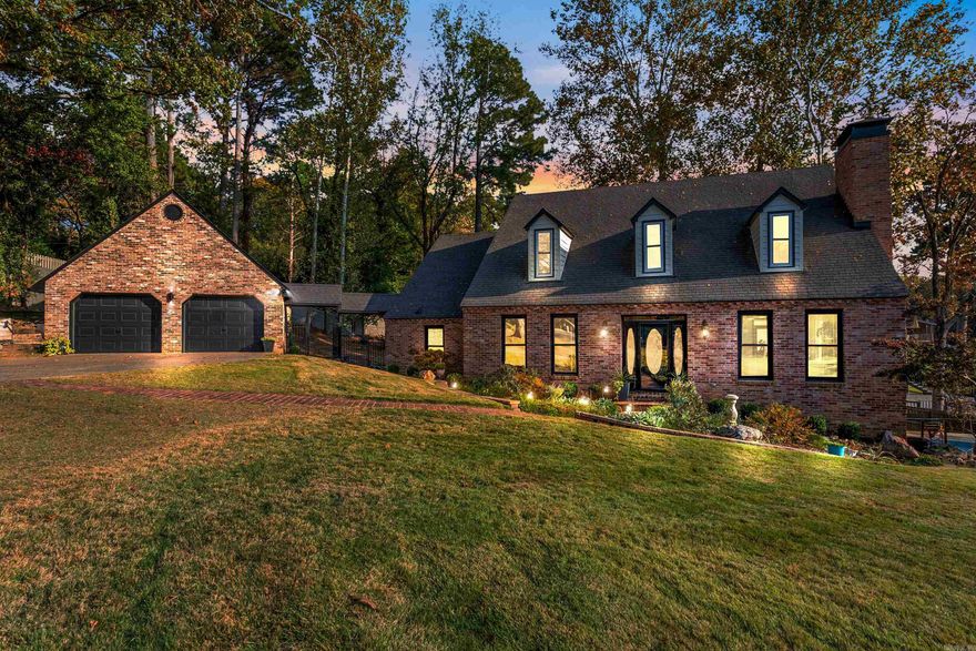 Luxury lakeside living, a masterfully remodeled retreat on Lake No. 2, where sophistication meets serenity in the heart of North Little Rock. This stunning 3 story residence offers beautiful water views, a heated salt water pool with waterfall, & an entertainer’s dream layout designed for both grand gatherings & quite escapes. Step inside to discover a chef’s kitchen with quartz countertops, a designer backsplash, premium stainless steel appliances. New hardwood floors grace the main level, while the home office features sleek new tile for a polished work space. The spa-inspired primary suite on the main level boasts a breathtaking walk-in shower with a rain shower head, while three additional bedrooms upstairs provide ample space for family or guests. Downstairs, enjoy a versatile bonus room, private gym, and a convenient kitchenette, ideal for entertaining or multigenerational living. Out back, unwind on the covered deck overlooking the shimmering pool & lake, framed by gas-fed tiki torches that cast a warm glow over evening gatherings. With over 2400 sqft of additional storage over the two car garage. This is more than a home, it's lakeside living reimagined. Agents see remarks.