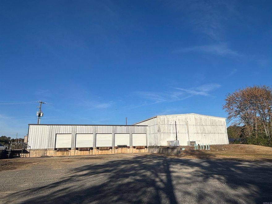 New industrial opportunity in Greenbrier with a 4,950-square-foot facility situated on 1.45 acres. Previously operated as an ice distribution center, this property features a substantial 2,500-square-foot freezer warehouse with 18-foot clear height, making it ideal for cold storage, food distribution, or specialized warehousing operations. The facility features five dock-level doors, a roll-up door for flexible loading, and three-phase power to support industrial equipment. A climate-controlled office space with a private restroom and an additional warehouse restroom provides functional support areas, while the gated entrance ensures security for your operations. Strategically positioned less than half a mile from Highway 65, this property offers exceptional regional accessibility. Whether you're seeking temperature-controlled storage, distribution capabilities, or industrial space with specialized infrastructure, this turnkey facility delivers the features and location to support your operation