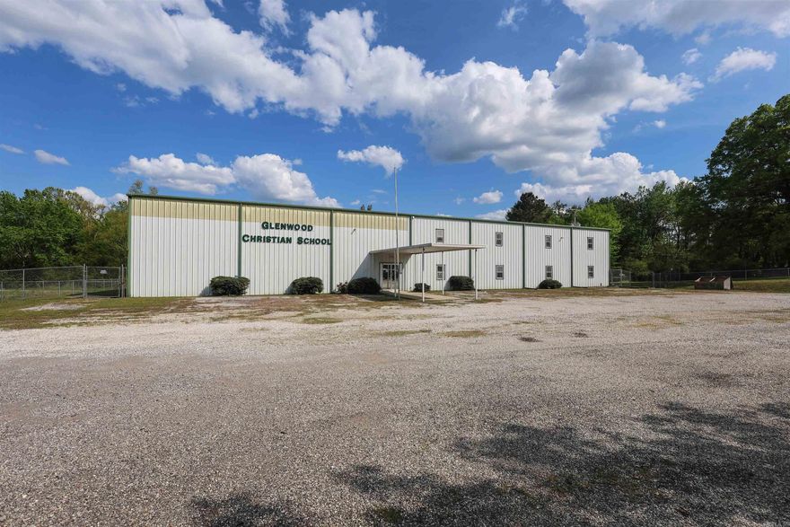 Versatile 13,200 sq ft building situated on approximately 3± acres with road frontage, conveniently located within the city limits of Glenwood, AR. Formerly operated as a private school, this well-positioned property is thoughtfully laid out to accommodate a wide range of potential uses including office space, educational facilities, daycare, event venue, or other commercial opportunities.  The interior offers multiple classrooms on both the main level and upper floor, providing flexibility for a variety of layouts and operations. Spacious common areas and functional design allow for easy adaptation to suit your business or investment goals.  Outdoors, the property features a fenced playground area, making it especially appealing for childcare, educational programs, or other structured group activities. The expansive acreage provides ample room for additional parking, future expansion, or outdoor recreational space—an increasingly valuable asset for commercial properties.  With its combination of size, layout, and location, this property presents a unique opportunity for investors and business owners seeking a multi-purpose space with room to grow in the Glenwood area.