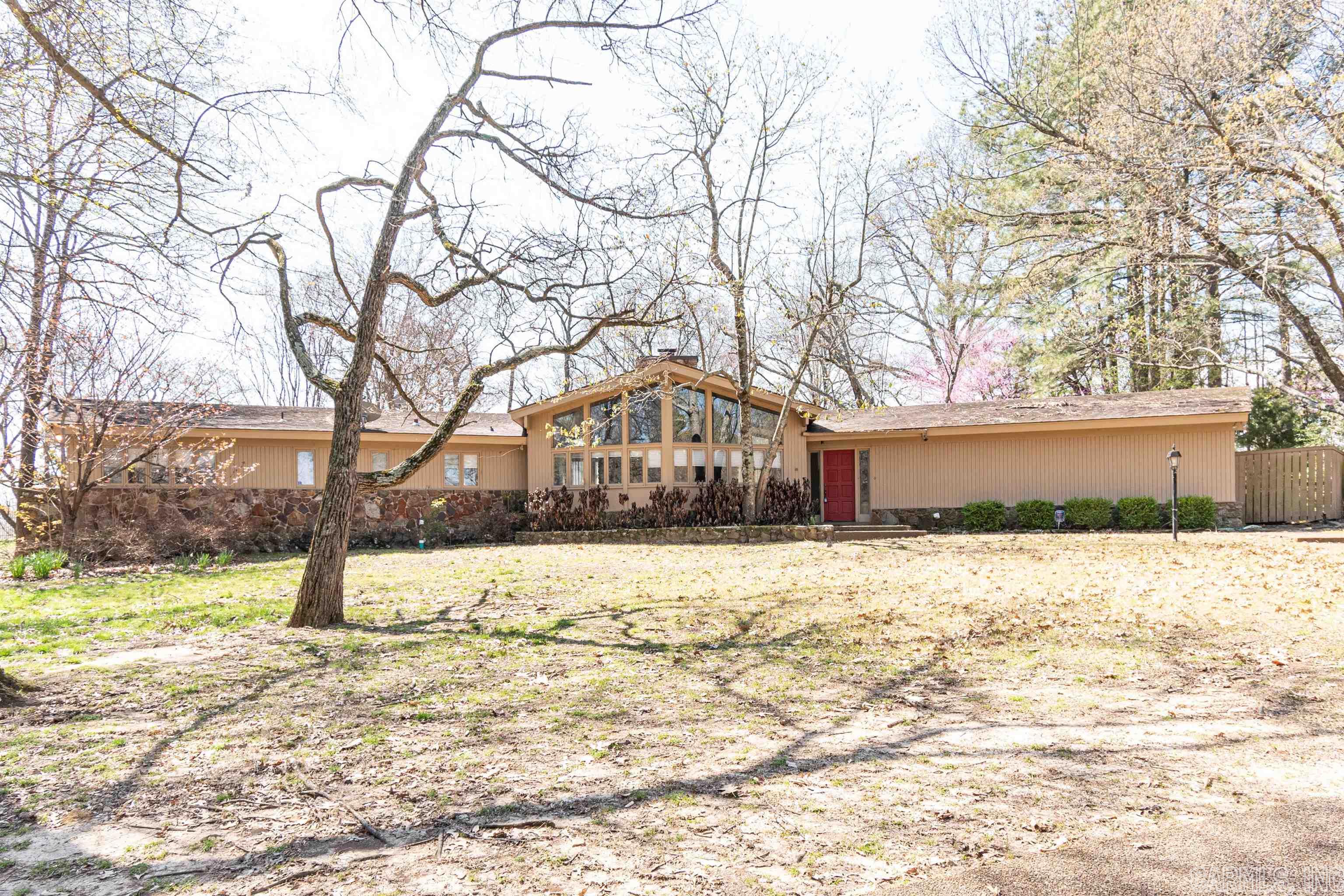 This classically beautiful Marshall Estates property is a one-of-a-kind gem. It sits on the largest lot in the neighborhood and backs up to the 11th fairway of the JCC. Though the house was well maintained, the overall property is ripe for remodeling or redevelopment. The enormous lot lends itself to a variety of options for any new owner to make it their own. Don't miss the detached shop/cart shed that has gas/elect and overhead door.