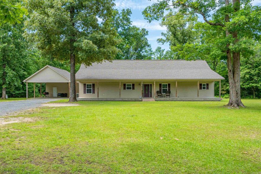 Spacious 3 bedroom 3 bath home sitting on 10.23 acres with mature trees, overlooking a beautiful, stocked pond.  This is a must see retreat within 5 minutes of Arkadelphia amenities.  Split floorplan with open concept home featuring vaulted ceilings in family area, large laundry room off primary ensuite, amazing views from front and back porches.  Additionally, this property features a 35x50 shop with a 600 sf 1 bedroom 1 bath, efficiency apartment.  The property is stunning for entertaining, fishing, gardening, other outdoor activites or simply enjoying the view.