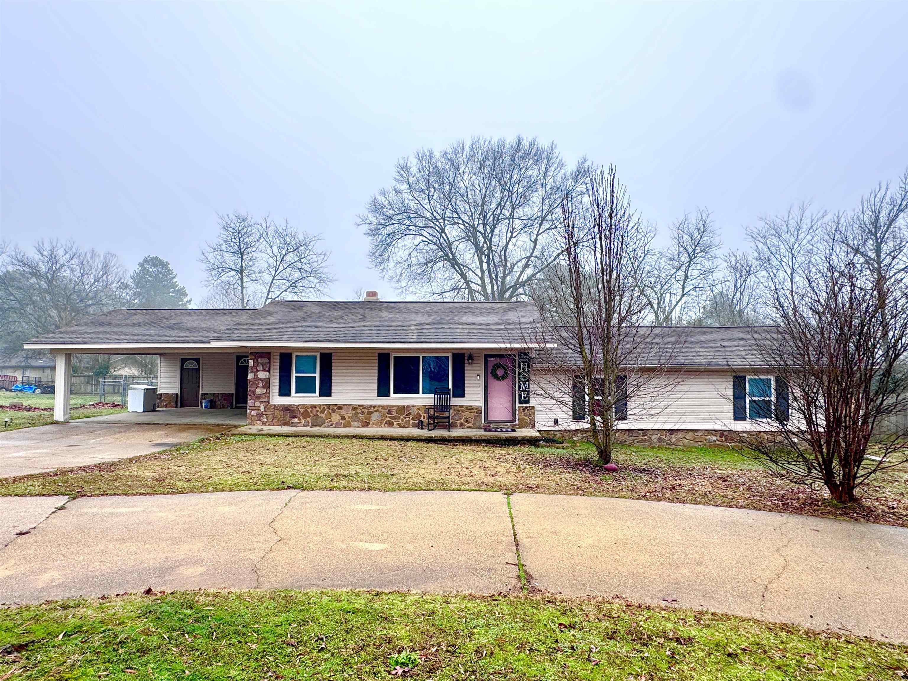 Lakeside Home in Pine Meadows Subdivision! This home is located in a well-established neighborhood with a covered back deck and fenced-in backyard for dogs and kids to run and play. This house has a little of everything- great little kitchen, nice space for a breakfast table, a separate laundry room, and a combination living and dining area for family to gather around the big rock fireplace. All this combined with a circle drive on a cul-de-sac?? Absolutely! Call for your tour today!