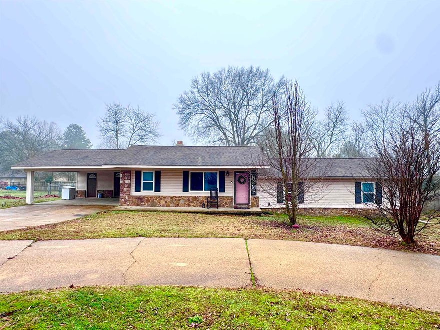 Lakeside Home in Pine Meadows Subdivision! This home is located in a well-established neighborhood with a covered back deck and fenced-in backyard for dogs and kids to run and play. This house has a little of everything- great little kitchen, nice space for a breakfast table, a separate laundry room, and a combination living and dining area for family to gather around the big rock fireplace. All this combined with a circle drive on a cul-de-sac?? Absolutely! Call for your tour today!