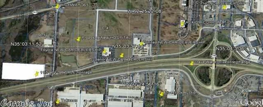 11.5 acres across street from Baptist Hospital on I-40.  Excellent location for medical office, car dealership, nursery, etc. Spans from interstate to the gravel road (the width of the siding company plus the vacant lot). Property is generally rectangular in shape, and runs 1,091 feet parallel to and fronting the interstate.  Permanent 30' access easement for driveway.