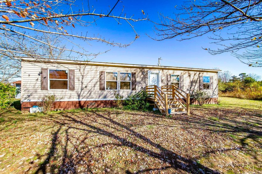 Escape to country living with this spacious 3-bed, 2-bath mobile home on 79.84 acres of prime farmland! The open floor plan features a modern kitchen with an island and a large walk-in pantry. The primary suite offers luxury with double sinks, a walk-in shower, a soaker tub, and a walk-in closet. Additional amenities include a storm shelter, a whole-home generator, and endless potential for farming or outdoor activities. Don't miss this prefect blend of comfort and opportunity!  See agent remarks.