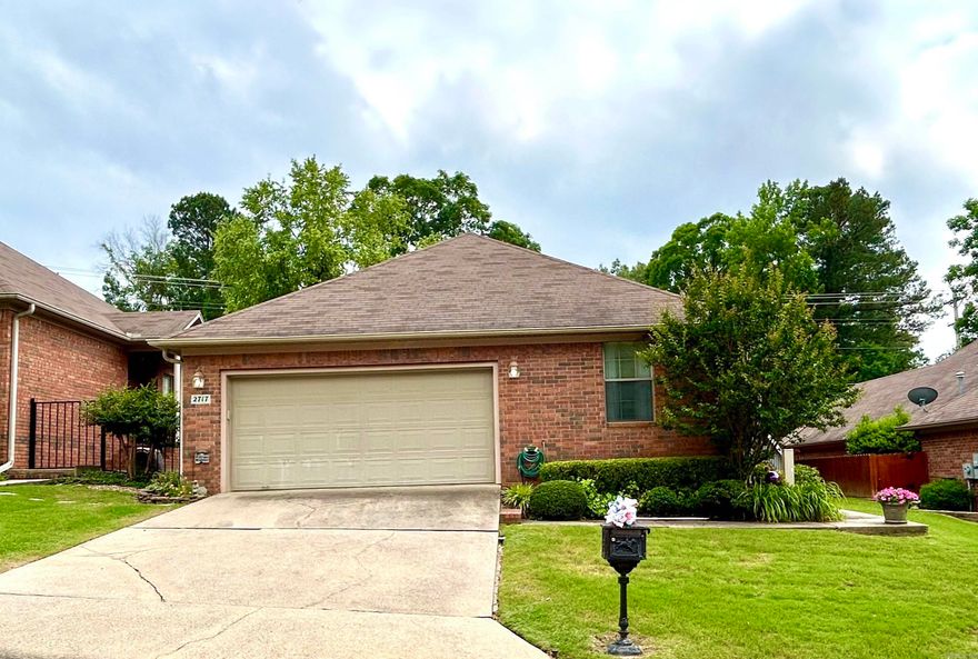 Looking for a low maintenance, comfortable home?   This all brick garden style patio home is very spacious with two bedrooms in over 1750 sq ft!   It features a private side porch and small flowered backyard for outdoor relaxing.   Little to no yard work - the front mowing is taken care of for you!   Recent improvements include roof, stove, microwave and water heater.   The kitchen has plenty of cabinets, countertop space, two pantries and a breakfast bar - and there's room for an island or breakfast table.  Separate dining room.   The open living and dining areas are large enough to entertain family and friends comfortably.   Primary bedroom is separate from guest bedroom and features a large bathroom and walk-in closet.   Laundry room with storage.   Two car garage with large storage area.  Great location!