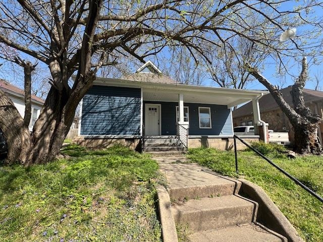 COTTAGE CRAFTSMAN STYLE HOME WITH AN EXPANSIVE FRONT PORCH. THREE BEDROOMS AND ONE BATHROOM WITH A MODERN KITCHEN AND UPDATED VINYL SIDING. DETACHED PARKING THAT IS COVERED. see agent remarks