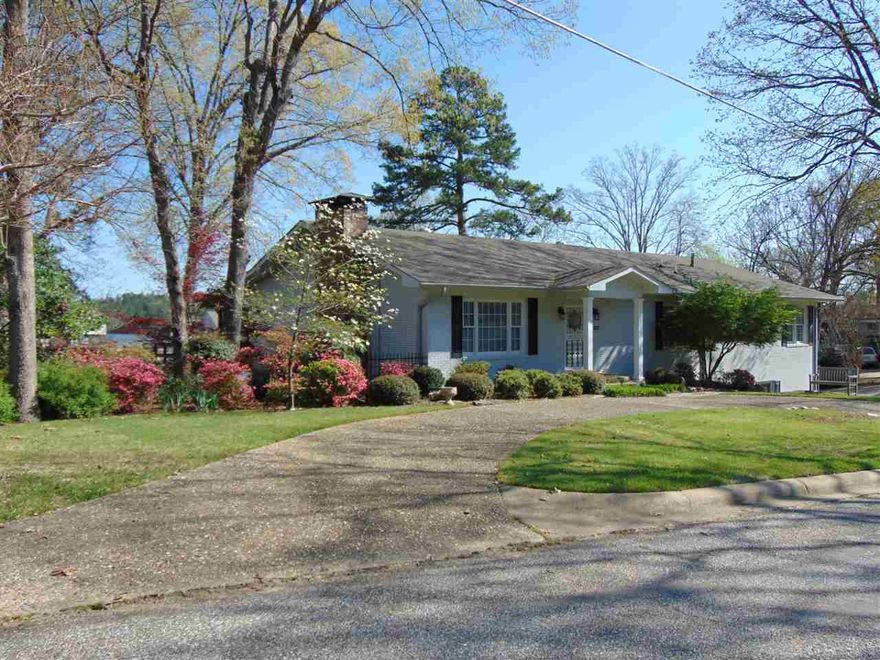 The lake home you've been waiting for!  Each bedroom has its own bath.  Mstr. suite w/ his and hers closets.  Mstr. sitting area.  Custom kitchen cabinets w/ glass front.  Numerous closets.  Boat house w/ 3 slips, 2 have boat lifts.  Landscaped lawn w/ lake irrigation system.  3-car garage.  Screened deck is 12X68.  With 227' of lake frontage, along w/ your own private boat launch.  Beautifully landscaped.  Custom green-house.  Rock retaining wall for pull-around garage entrance.  Situated on 2 lots, truly