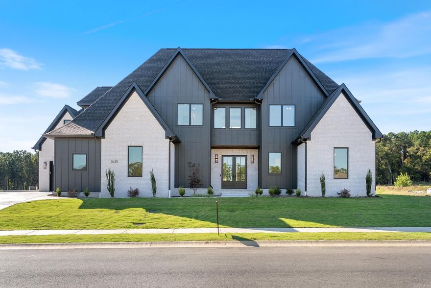 Stunning custom built home in Conway‘s Lands End subdivision offering 5 bedrooms, 4.5 baths and 4192 ft.² with a wonderful open floor plan. The main level features a grand living room with tall ceilings, built-in cabinetry/bookshelves, stunning fireplace & engineered hardwood flooring adjacent to a gourmet kitchen w/ quartz & granite countertops, large center island, gas range, pot filler, side-by-side refrigerator/freezer and a wonderful dining area with access to the back covered patio. The main level primary suite boasts a wonderful spacious bedroom and luxurious primary bath w/quartz countertops, double sinks, custom cabinetry, soaker tub, huge tiled walk-in shower & spacious custom closet with built-ins. Upstairs offers a game room, office, 4 additional bedrooms and a second laundry room. Enjoy year-round outdoor living on the covered back porch with stained tongue-and-groove ceiling and gas grill hookup. Extras include two tankless water heaters, Pella windows, spray foam insulation, irrigation system, insulated 3-car garage with Wi-Fi openers and custom crown molding throughout. This home perfectly blends high-end finishes, thoughtful design and everyday comfort.