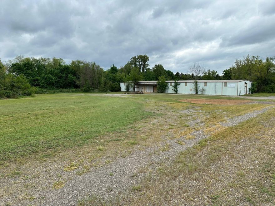 Commercial acreage and warehouse on the east end of Russellville. Fantastic location near truck stops, I-40 and Russellville commercial corridor.