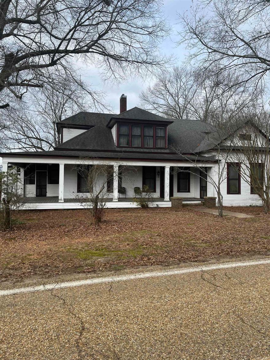 When you drive up the wraparound and screened porch invites you to sit in rocking chair and relax.  Located on approximately one and half acres. This one and half story home was built in 1915 by the owner’s grandfather.  Most, if not all the lumber was from virgin timber from the grandfather’s sawmill.  The floors are pine throughout and the staircase going upstairs will get your attention with its craftsmanship.  The 3,492 square foot home boasts 6 bedrooms and two baths. No mineral rights convey