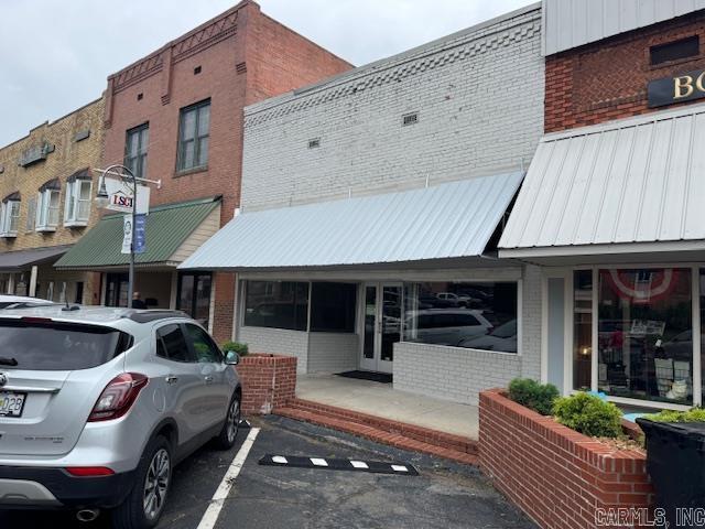 REMODELED BLDG ON COURT SQUARE! Built in 1930 and remodeled in June 2020, this former bakery is ready for a new business! Building main level is 2048 square foot with a 375 square foot finished basement. There are 4 work rooms, 3 half bathrooms and a huge show room with sales counter and 2 way mirror. Updates on this building include new central heat and air on 12/28/21, new roof on 3/27/23, new gutters on 5/27/23, new tuck point on 5/24/23, new 50 gallon water heater in 2021 and new awning in May 2025. Some new electrical, 220 outlet and ceiling fans in showroom. Good solid tile floors just need a little buffing! Located on the Historic Pocahontas Court Square next to a book store and florist. Sitting on a 26X90 lot. The possibilities are endless!