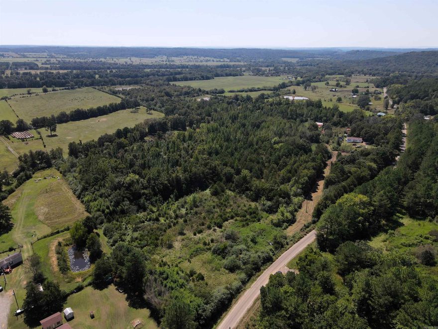 - 10 +/- acres  - Numerous build sites - 2.5 +/- acres of pasture - Utilities on the property - WMA border - Partially fenced - County road frontage  - No restrictions - Outside city limits - 20 miles to Morrilton  https://midwestlandgroup.com/listings/conway-10-2/ - 4 miles to Center Ridge