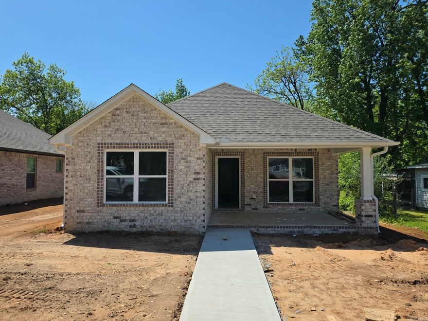Welcome to this charming new construction home in the Northend Overlay District. Featuring 3 bedrooms and 2 baths, this thoughtfully designed all-brick home offers a functional layout with no wasted space. Enjoy relaxing on the covered front porch and the timeless appeal of quality new construction.