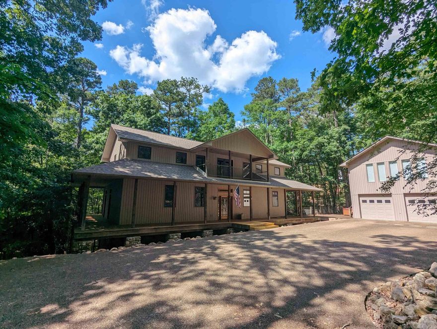 Custom built home in Harbor South with wrap around deck, oversized 2 car detached garage. 757 sq apartment with a full kitchen and full bath not included in total sq footage.