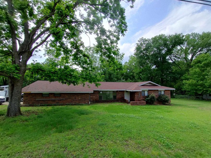 Spacious home in the heart of Russellville, AR. This home boasts 3 bedrooms, a family room, and a living room, plus a large backyard for all of your entertaining needs. At 2154 sq ft of space you will have plenty of room to spread out. This home offers a master suite with a half bath and a walk in closet, two good size bedrooms, 1 full bath, plus a large family room with a wood burning stove and built in shelves. You will not want to miss out on this gem.