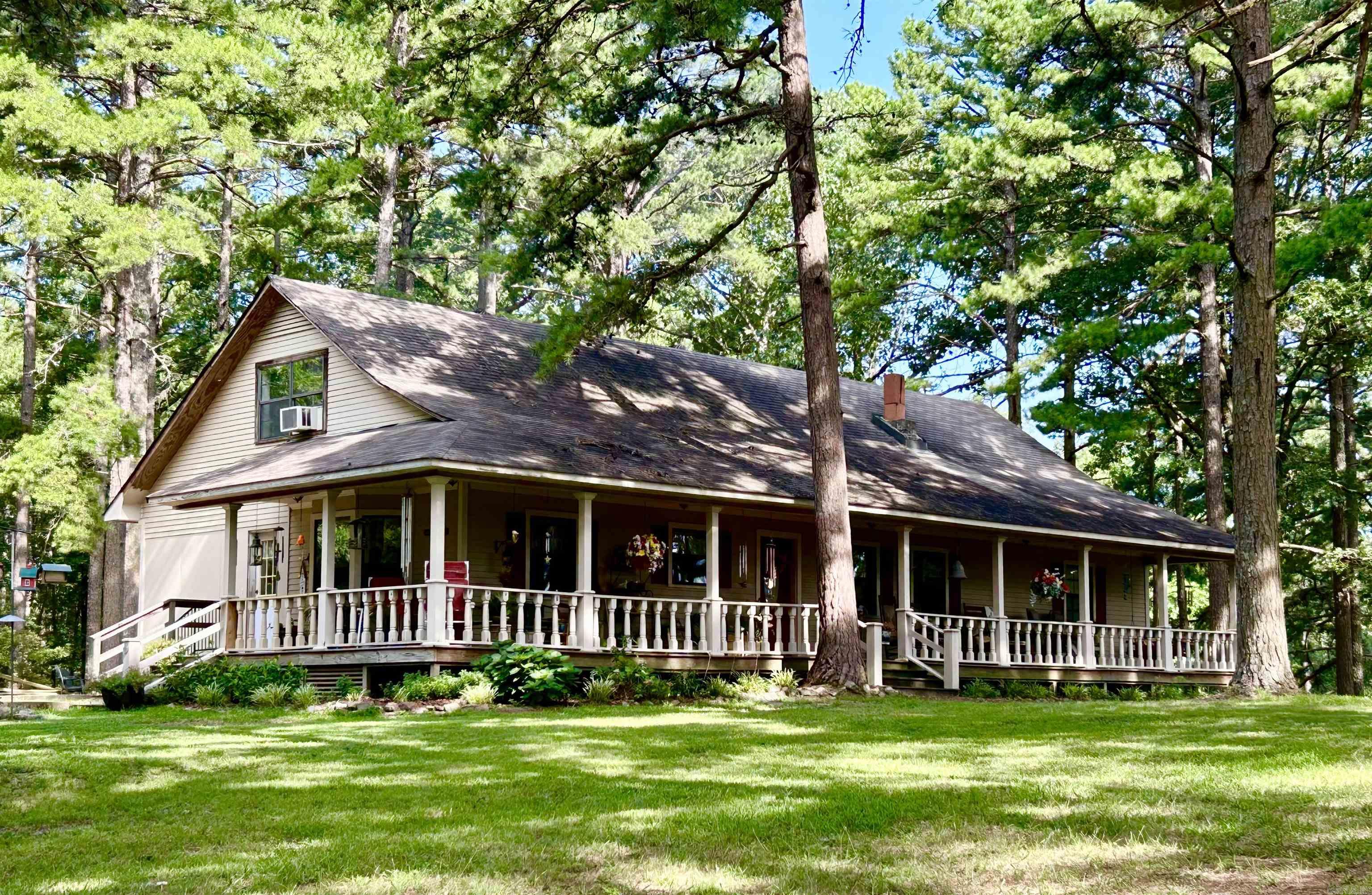 *** PRICE IMPROVEMENT *** Welcome Home! Sitting on nearly 6 acres, this charming country home on Wye Mountain is waiting on that personal touch to make it your own! With an incredible 3-sided wrap around porch, this 2400+SF, 2 story home offers 4 large bedrooms, an office/den, and 3 full bathrooms with plenty of storage, including an on-suite in the large Master Bedroom. A full bath is also located in a main floor bedroom that would be an ideal for an In-Law arrangement or private guest quarters. A large country kitchen with abundant cabinet space, a center island and beautiful woodwork, will make your next meal a comforting place for everyone. Hardwood floors offers elegance and charm. Relax on those cold evenings in front of the fireplace in the large family room. Several older outbuildings remain. Horses, chickens and other animals are permitted. Great opportunity to own acreage that is not only surrounded by mountains and countryside, yet is only 20 minutes to the convenience of all the shopping and amenities that Little Rock has to offer. This home is in the highly rated Bigelow School District. Ideal location!! **Agents - see remarks**