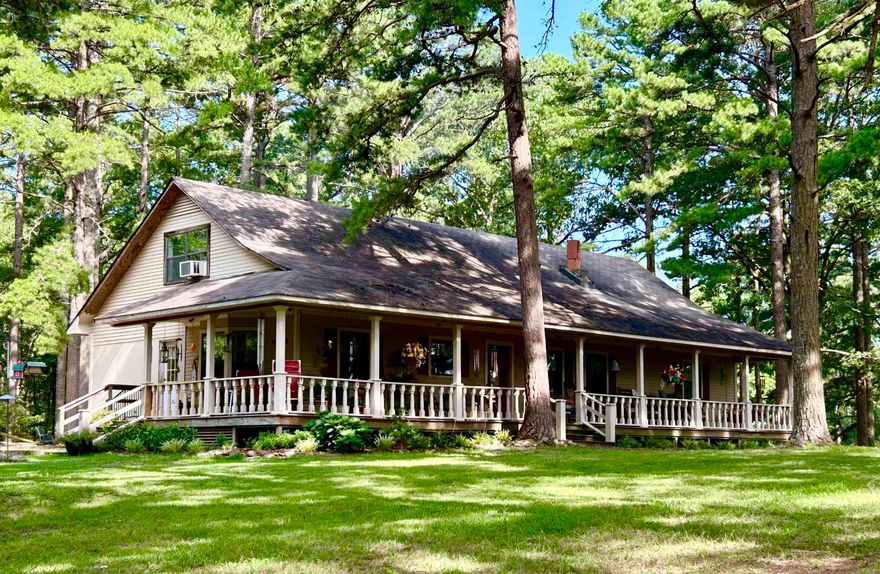 *** PRICE IMPROVEMENT ***   Welcome Home! Sitting on nearly 6 acres, this charming country home on Wye Mountain is waiting on that personal touch to make it your own! With an incredible 3-sided wrap around porch, this 2400+SF, 2 story home offers 4 large bedrooms, an office/den, and 3 full bathrooms with plenty of storage, including an on-suite in the large Master Bedroom. A full bath is also located in a main floor bedroom that would be an ideal for an In-Law arrangement or private guest quarters. A large country kitchen with abundant cabinet space, a center island and beautiful woodwork, will make your next meal a comforting place for everyone. Hardwood floors offers elegance and charm. Relax on those cold evenings in front of the fireplace in the large family room. Several older outbuildings remain. Horses, chickens and other animals are permitted. Great opportunity to own acreage that is not only surrounded by mountains and countryside, yet is only 20 minutes to the convenience of all the shopping and amenities that Little Rock has to offer. This home is in the highly rated Joe T. Robinson School District. Ideal location!!  **Agents - see remarks**