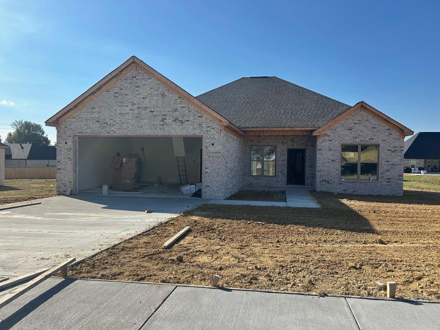 Beautiful New Construction in Vilonia’s newest subdivision! This all-brick build showcases Coretec luxury vinyl plank flooring throughout, quartz countertops, and a stylish electric fireplace. The open kitchen offers abundant cabinet space, a large peninsula, and Delta fixtures. A split floor plan provides privacy, while the primary suite features a sleek walk-in shower, relaxing soaker tub, and dual vanities. Enjoy a covered back patio overlooking the spacious backyard—perfect for entertaining or relaxing.