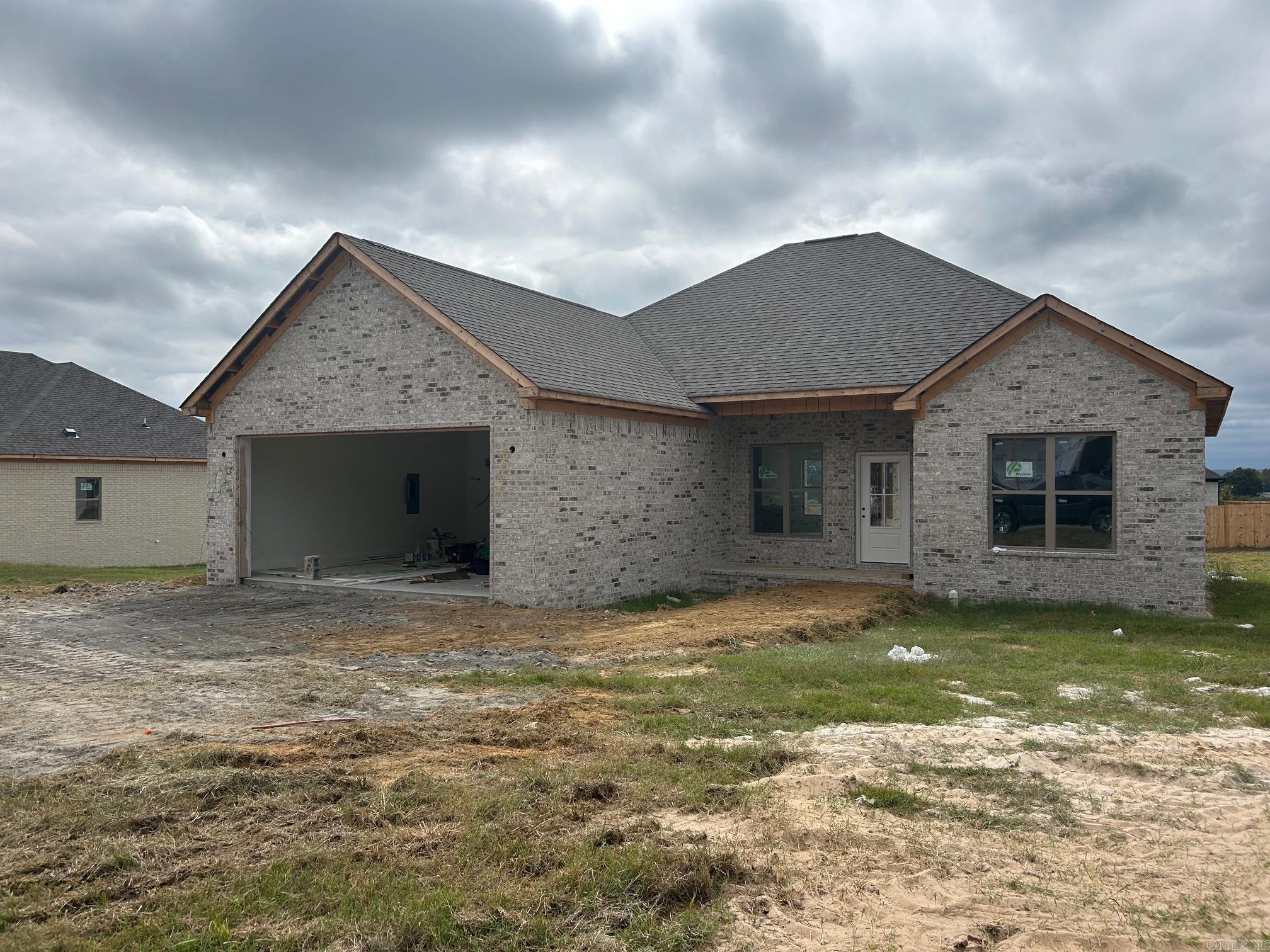 Beautiful New Construction in Vilonia’s newest subdivision! This all-brick build showcases Coretec luxury vinyl plank flooring throughout, quartz countertops, and a stylish electric fireplace. The open kitchen offers abundant cabinet space, a large peninsula, and Delta fixtures. A split floor plan provides privacy, while the primary suite features a sleek walk-in shower, relaxing soaker tub, and dual vanities. Enjoy a covered back patio overlooking the spacious backyard—perfect for entertaining or relaxing.