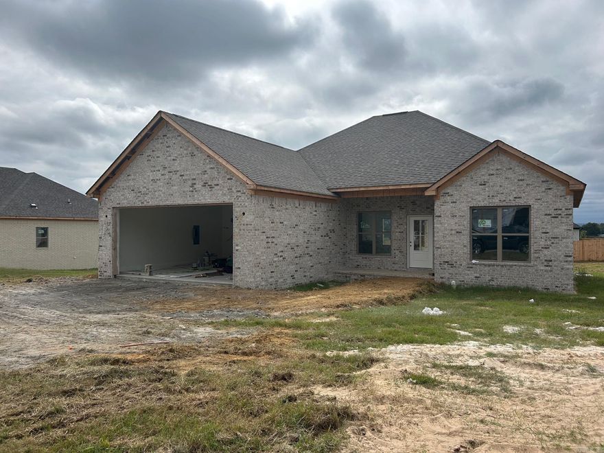 Beautiful New Construction in Vilonia’s newest subdivision! This all-brick build showcases Coretec luxury vinyl plank flooring throughout, quartz countertops, and a stylish electric fireplace. The open kitchen offers abundant cabinet space, a large peninsula, and Delta fixtures. A split floor plan provides privacy, while the primary suite features a sleek walk-in shower, relaxing soaker tub, and dual vanities. Enjoy a covered back patio overlooking the spacious backyard—perfect for entertaining or relaxing.