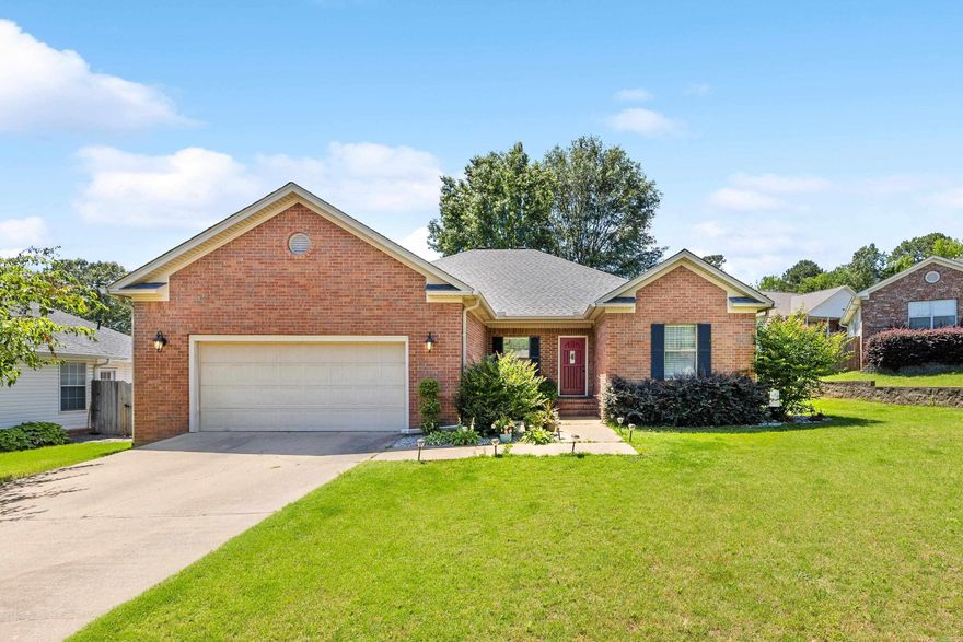This beautifully updated home sits on a quiet cul-de-sac in a sought-after neighborhood just minutes from I-30. Freshly painted and move-in ready, it features a split floor plan, high ceilings, and a bright, open feel. The large kitchen boasts quartz countertops, painted cabinets, and a breakfast bar that flows into the living room—perfect for everyday living or entertaining. Two dining areas offer flexible use. The spacious primary suite includes a walk-in closet, double vanity, soaker tub, and oversized shower. Both bathrooms have stylish updates, and the laundry room includes built-in mudroom storage. Outside, enjoy a wraparound covered patio, fully fenced yard, and an oversized garage with extra storage.