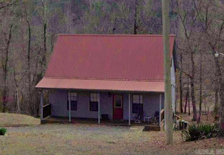 Escape to your own slice of paradise with this charming lake cabin offering both privacy and convenience. Enjoy easy access to the lake with 3 nearby boat launches and lake access within walking distance. The spacious deck is ideal for grilling, entertaining or unwinding in the serene outdoors. Tucked away on a quiet end of the lake, makes this cabin ideal for fishing, kayaking and peaceful relaxation. 10 min to Hill Creek Marina. 15 min to Greers Ferry and Tannenbaum Golf Course. See agent remarks regarding showings.