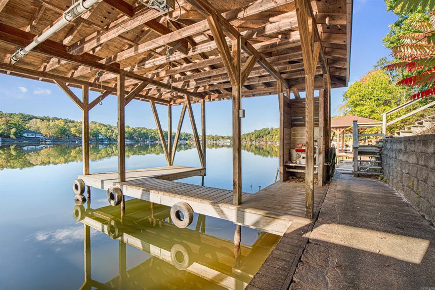 LAKE FRONT ON BALBOA!! COVERED BOAT DOCK! 3 CAR GARAGE! Beautiful ONE OWNER level 3 bed 2.5 bath home on Lake Balboa! Hardwood floors! Screened Sunroom off of dining area! Additional heated and cooled sunroom off of the master ensuite! Large Workshop off of garage!  Roomy kitchen with Custom Cabinets and Granite Countertops! Hardwood floors! Primary En-suite with his and hers walk-in closets! Split-floorplan for Privacy! Over-sized utility room with large built-in cabinetry, large deck, loads of storage and half-bath! This home has been very well-loved! Seller is VERY MOTIVATED!