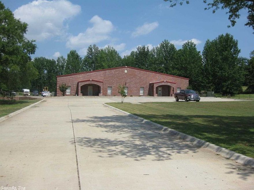 10,000 sq ft Warehouse/Business combo on 4 Acres.  Plenty of room for expansion.  High ceilings, 2,700 ft heated and cooled offices in front, 2,700 sq ft mezzanine in warehouse.  (2) 400 Amp- Phase III services, (4) 14' O/H doors. All Brick sidewalls with metal roof.  High traffic area.  Covered porch area in back that will allow for expansion of current building.  Additional home on property will be sold 'AS IS'.