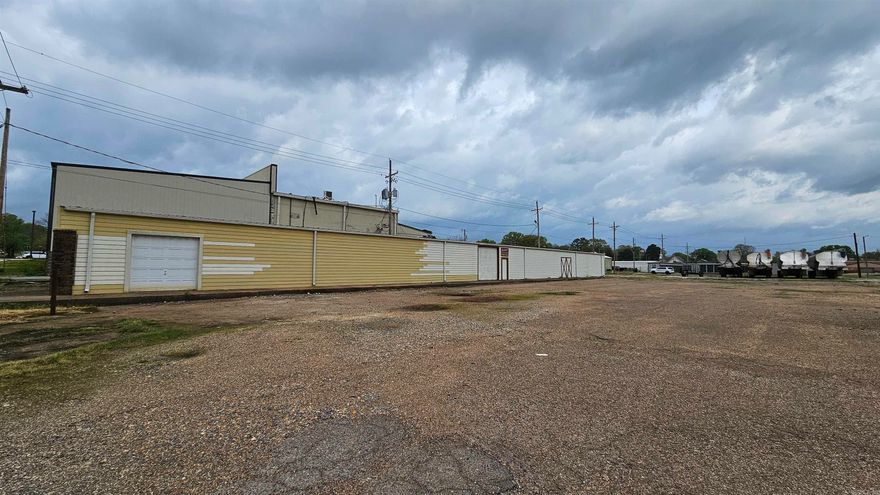 Just think of what a person could do with this very large building!  Plenty of area for storage and still room for a business!  Or maybe a couple of businesses!! There are garage doors in a couple of places plus regular doors too!