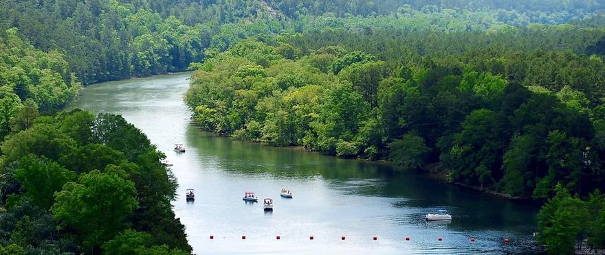 Discover a rare opportunity to own over 6 acres of scenic property along the beautiful Ouachita River, featuring approximately 100 feet of direct river frontage. This unique parcel was originally purchased with development in mind and is already platted with road base in place for 11 spacious RV sites—making it an excellent investment for a future campground or recreational retreat.  Electric service is available, and arrangements for septic access have already been secured. Water access can be established either through a neighboring well agreement or by installing a portable water system, offering flexibility for development.  In addition to the main property, this offering includes an extra 1.4-acre parcel located at the Fulton Branch Recreation Area downstream. This added acreage provides convenient river access—ideal for entry or exit when floating the river, enhancing the overall recreational appeal.  Whether you're looking to develop, invest, or create a private getaway, this property offers outstanding potential in an excellent riverfront setting.