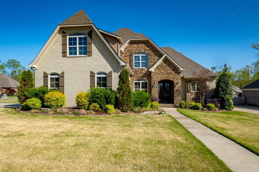 Wonderful painted brick & stone, level corner lot, side load 3 car garage on cul-de-sac. Open living with 2 story ceilings in great room, stone gas fireplace, hardwoods thru out main level. Chef's kitchen- 5 gas burner, stainless appl., granite island, breakfast bar, oversized eat-in area. Spacious master suite, mud room, & sink in laundry. 3 BR up with en-suite bath, versatile BR or bonus room. Cozy covered back patio; sprinkler system.