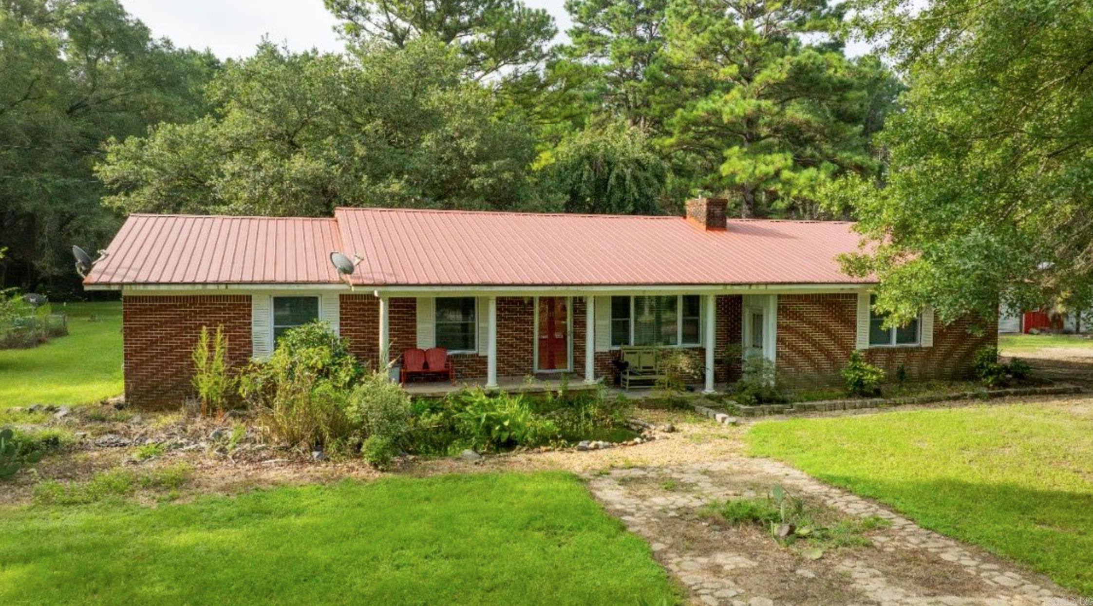 Beautiful country living home with sunroom that sit on 4.94 acres about ten minutes from town . Home has large shop with plenty of storage