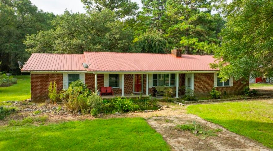 Beautiful country living home with sunroom that sit on 4.94 acres about ten minutes from town . Home has large shop with plenty of storage