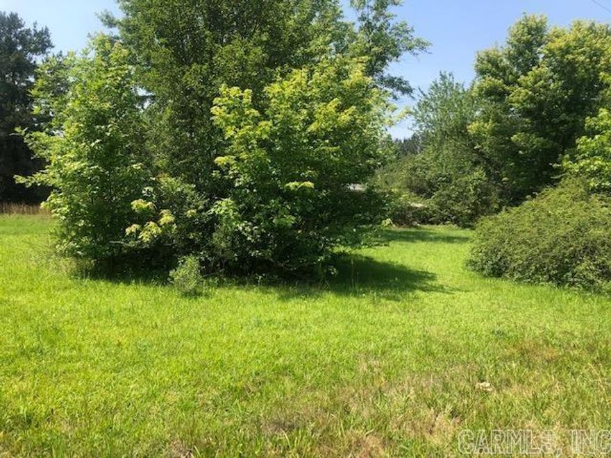 7.06 acres with a Moble Home needs some work. Has a pond setting at the back of the Property.This could be made into your dream home.