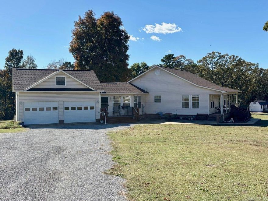 Welcome to this inviting single-level home set on a beautiful open lot. This 3-bedroom, 2 bath residence offers comfort, functionality, and country living just minutes from town conveniences. This home features an open floor plan with bright living areas. A large living room, kitchen and dining area make it perfect for gatherings. Primary suite with ensuite bath, while the additional bedrooms offer space for family or guests. Enjoy relaxing on the full covered front porch or grilling out on the full back deck. Includes a double garage with an additional bedroom in the attic space above. Storage building and small greenhouse along with a fenced in area for your pets or garden. Fruit trees, grape vine and blueberry bushes!! You're not going to want to miss this gem!