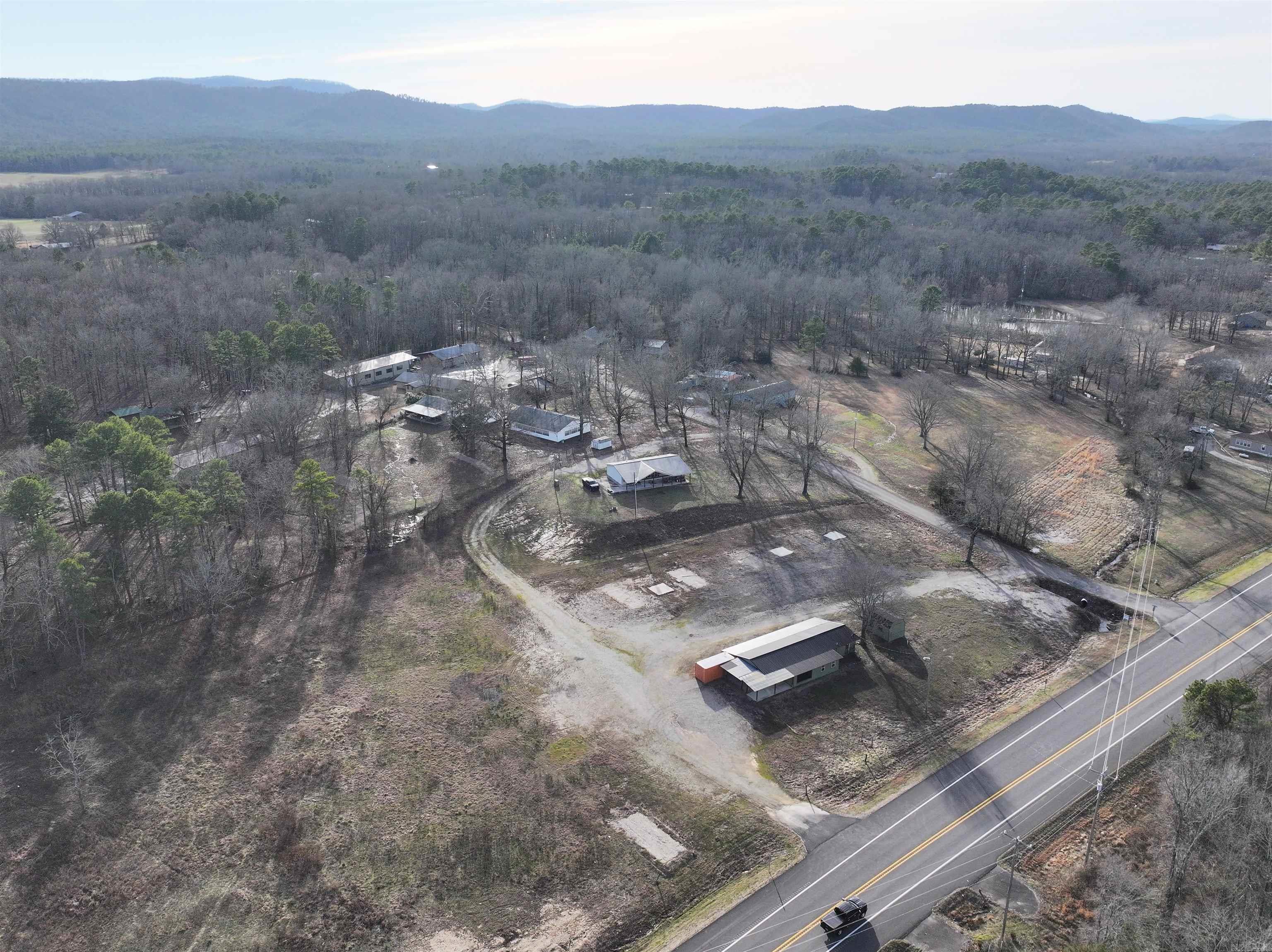 Prime Investment Opportunity Near Lake Ouachita! Looking for a property with tons of potential? Check out this 1,500 sq. ft. building located on 4.7+/- acres just minutes from beautiful Lake Ouachita! Formerly known as Road Tripān, this property has been partially developed with 3 septic tanks, city water, and an RV dump station, making it perfect for a variety of uses. While the building currently has a bathroom and kitchen, there is no shower or tub, allowing you to customize it to fit your needs. Whether you're thinking about a rental, retreat, or other ventures, this location offers plenty of space and possibilities. Located at 2383 Hwy 270 E, Mount Ida, Arkansas, donāt miss out on this opportunity to own a piece of land with HWY 270 frontage!